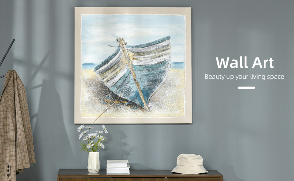 Three-D wooden boat pictures on wall above painted chest in coastal living  room with white sofa Stock Photo - Alamy