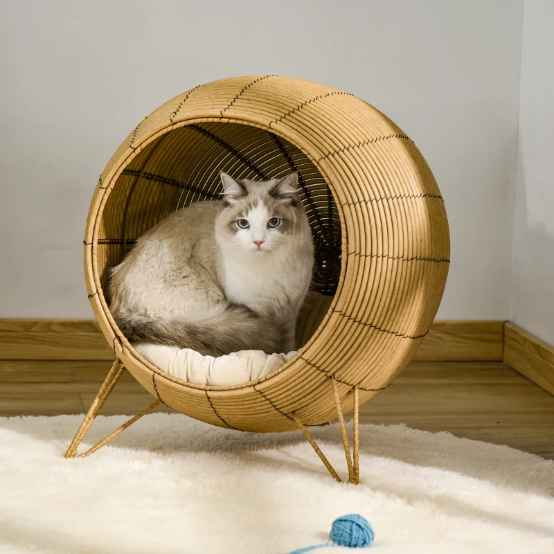 PawHut Cama de Ratán para Gatos Cueva de Mimbre para Gatos Mascotas Pequeñas con Cojín Acolchado Suave y Base Trípode Diseño Elevado Ø52x58 cm Marrón Claro