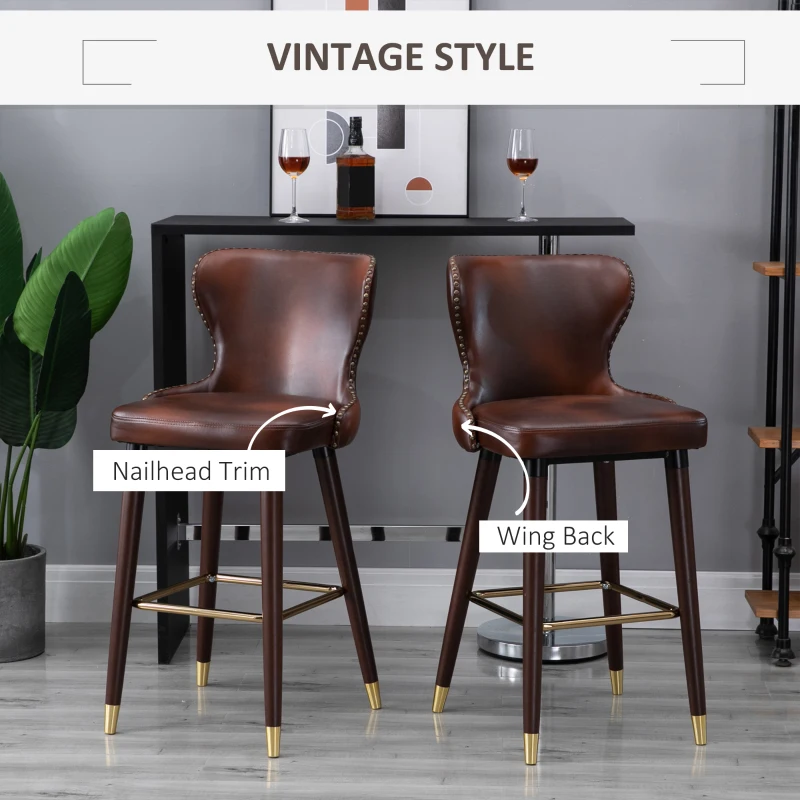 HOMCOM Bar Stools Set of 2, PU Leather Upholstered Breakfast Bar Chairs with 71cm Seat Height, Retro Kitchen Stools with Wingbacks, Nailhead Trim and Footrest, Brown