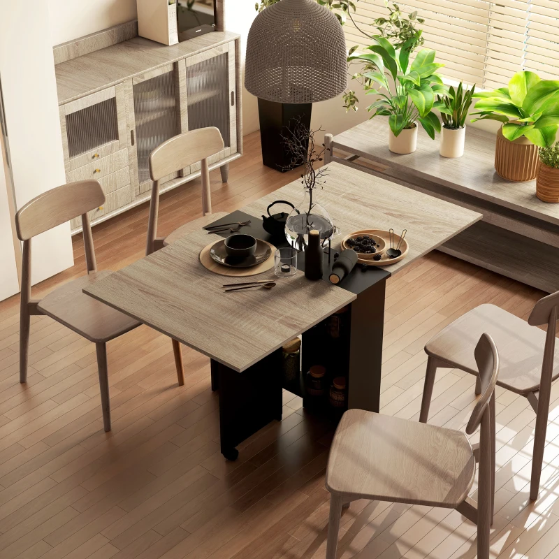HOMCOM Folding Dining Table, Drop Leaf Table for Small Spaces with 2-tier Shelves, Small Kitchen Table with Rolling Casters, Oak and Black