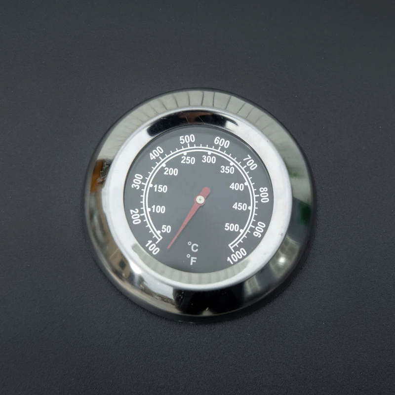 Tisch-Gasgrill mit zusammenklappbaren Beinen - 2 Brenner 5 KW - Camping-Gasgrill - Grillrost, Fettauffangschale, Thermometer - Lebensmitteltauglicher schwarzer Stahl