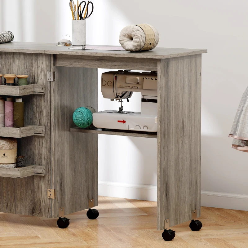 HOMCOM Table de couture pliante meuble couture à abattant avec bacs de rangement, étagère ouverte et roulettes effet bois grisé