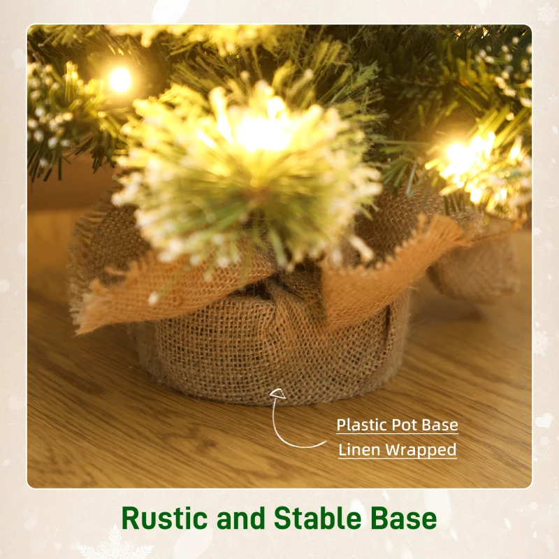 HOMCOM 60 cm Prelit Small Christmas Tree, Snow Flocked Tabletop Mini Xmas Tree with 35 LED Lights, Pine Cones and Linen Cover Base, Battery Operated, Green