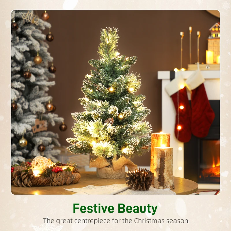 HOMCOM 60 cm Prelit Small Christmas Tree, Snow Flocked Tabletop Mini Xmas Tree with 35 LED Lights, Pine Cones and Linen Cover Base, Battery Operated, Green
