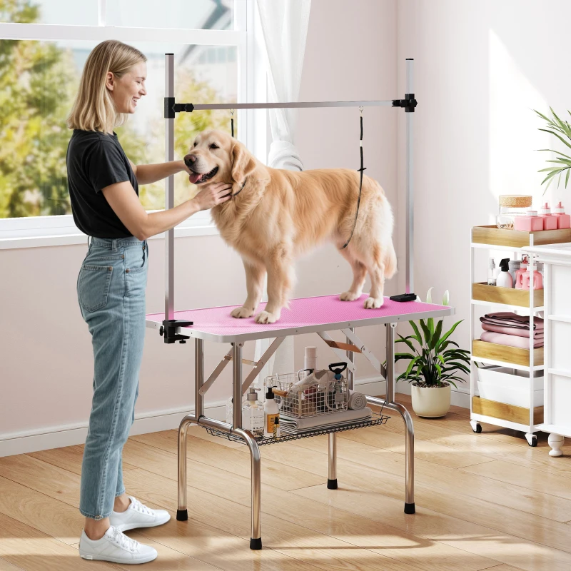 PawHut Mesa de Peluquería Canina Plegable con Cesta Metálica Barra de Acero Inoxidable Ajustable 107x60x164 cm Rosa