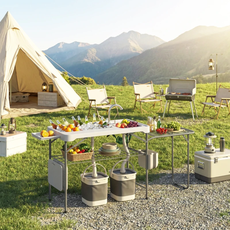 Outsunny Mesa Plegable Camping con 2 Fregaderos Grifo Manguera Estante Lateral Cajón Cesta Rejilla Regla y Ranuras Blanco