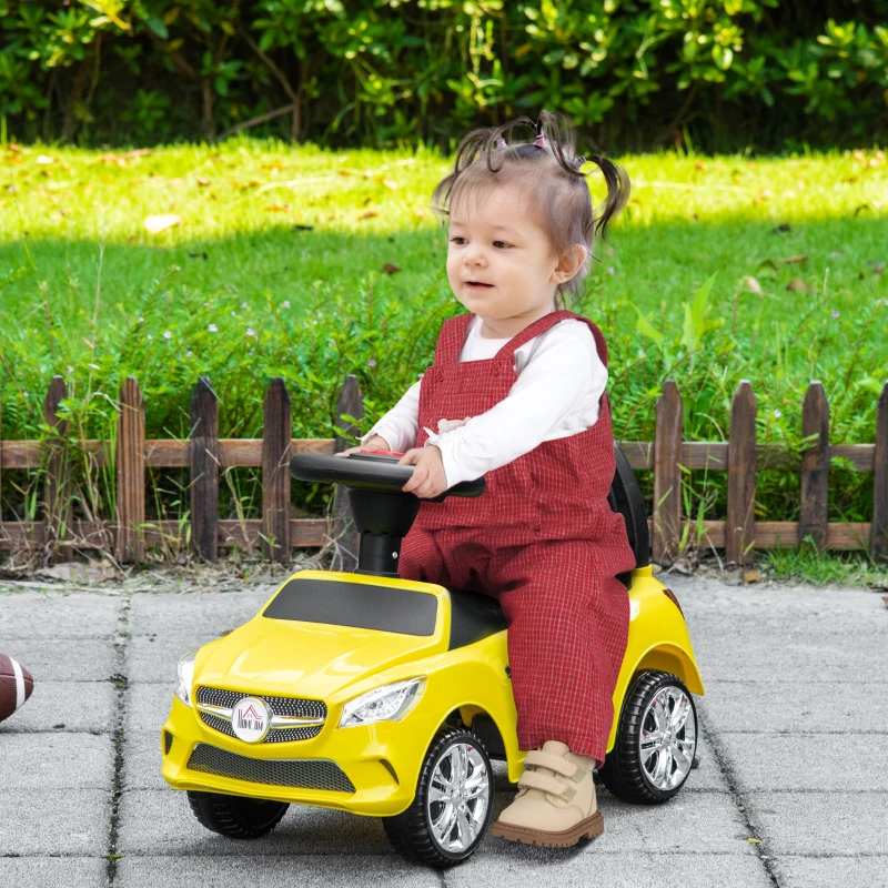 HOMCOM Macchinina per Bambini Cavalcabile con Volante, Fari e Musiche Integrate, Macchina per Bambini in PP e Metallo, 63.5x28x36 cm, Giallo