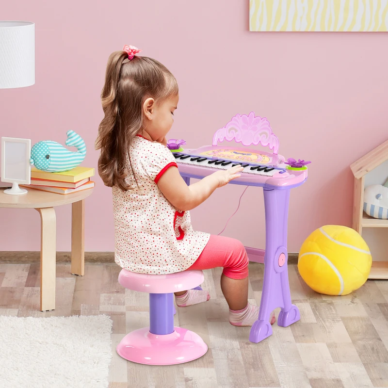 HOMCOM Teclado Electrónico Infantil 32 Teclas Juguete Musical Piano Infantil Piano para Niños con Micrófono Taburete Luces Variedad Sonidos Rítmos Melodias MP3 Karaoke Modo de Enseñanza Rosa