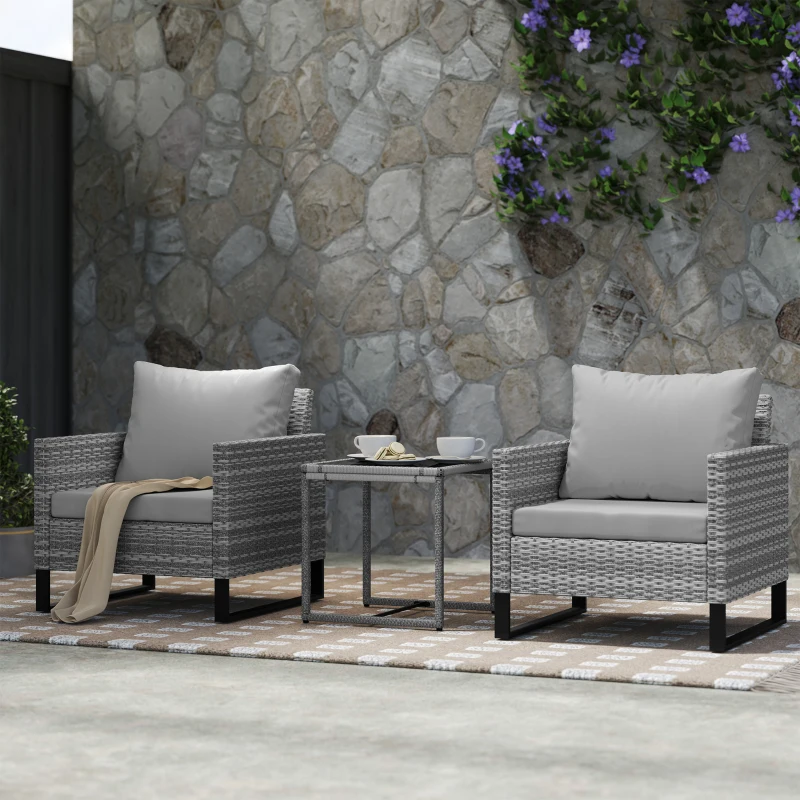 Outsunny 3 Pieces Rattan Bistro Set with 4 Cushions, Wicker Garden Furniture Set, Glass Top Coffee Table and Chairs for Outdoor Patio, Balcony, Terrace and Conservatory, Grey