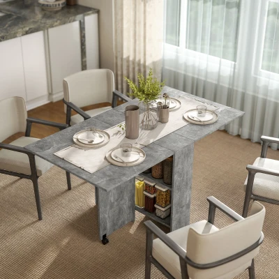 HOMCOM Mesa de Cocina Plegable con Ruedas 2 Estantes de Almacenaje y 2 Alas Abatibles Estilo Moderno 75x140x74 cm Gris Cemento