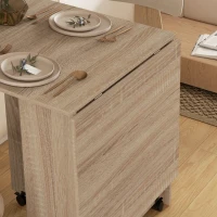 HOMCOM Folding Dining Table, Drop Leaf Table for Small Spaces with 2-tier Shelves, Small Kitchen Table with Rolling Casters, Natural(m-9)