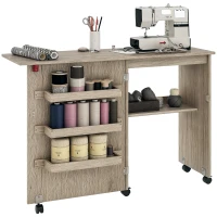 HOMCOM Table de couture pliante meuble couture à abattant avec bacs de rangement, étagère ouverte et roulettes effet bois grisé(m-10)